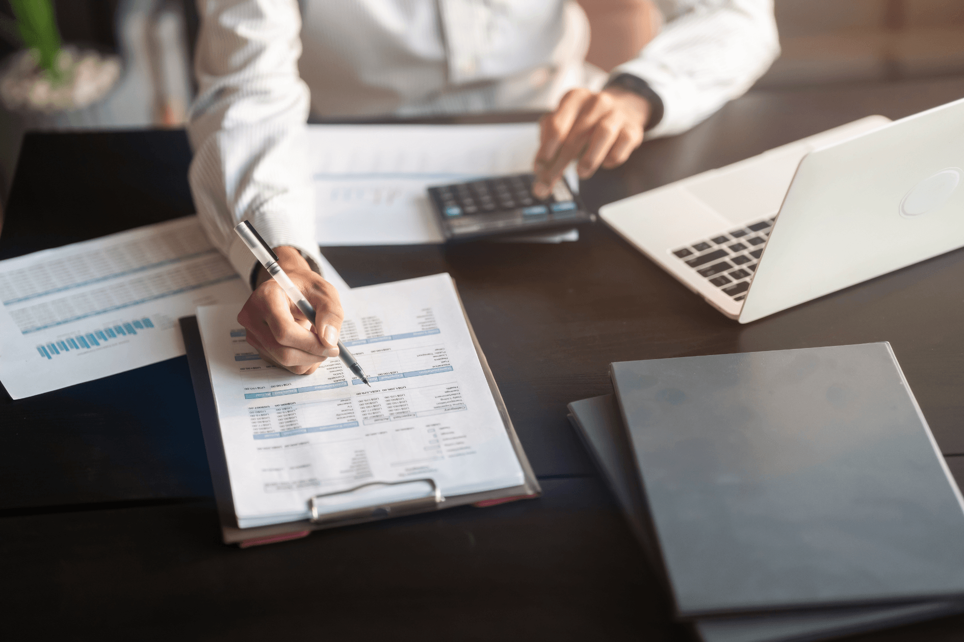 manager going over finance paperwork