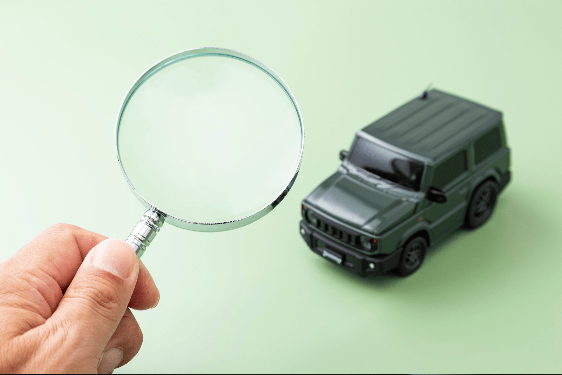 magnifying glass looking at jeep. Displaying trade appraisals.
